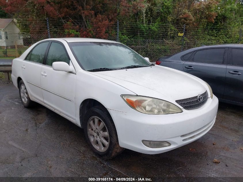 Lot #2488539682 2003 TOYOTA CAMRY XLE salvage car
